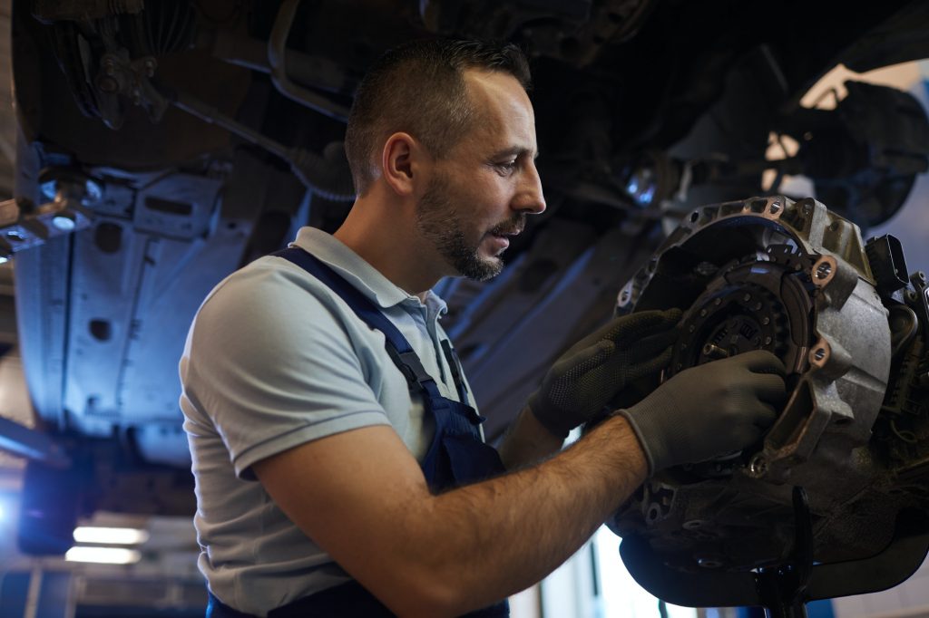 Mechanic Repairing Car